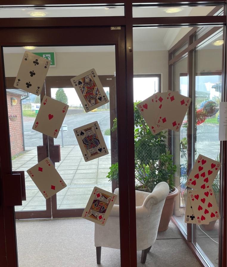 playing-cards-stuck-on-a-window