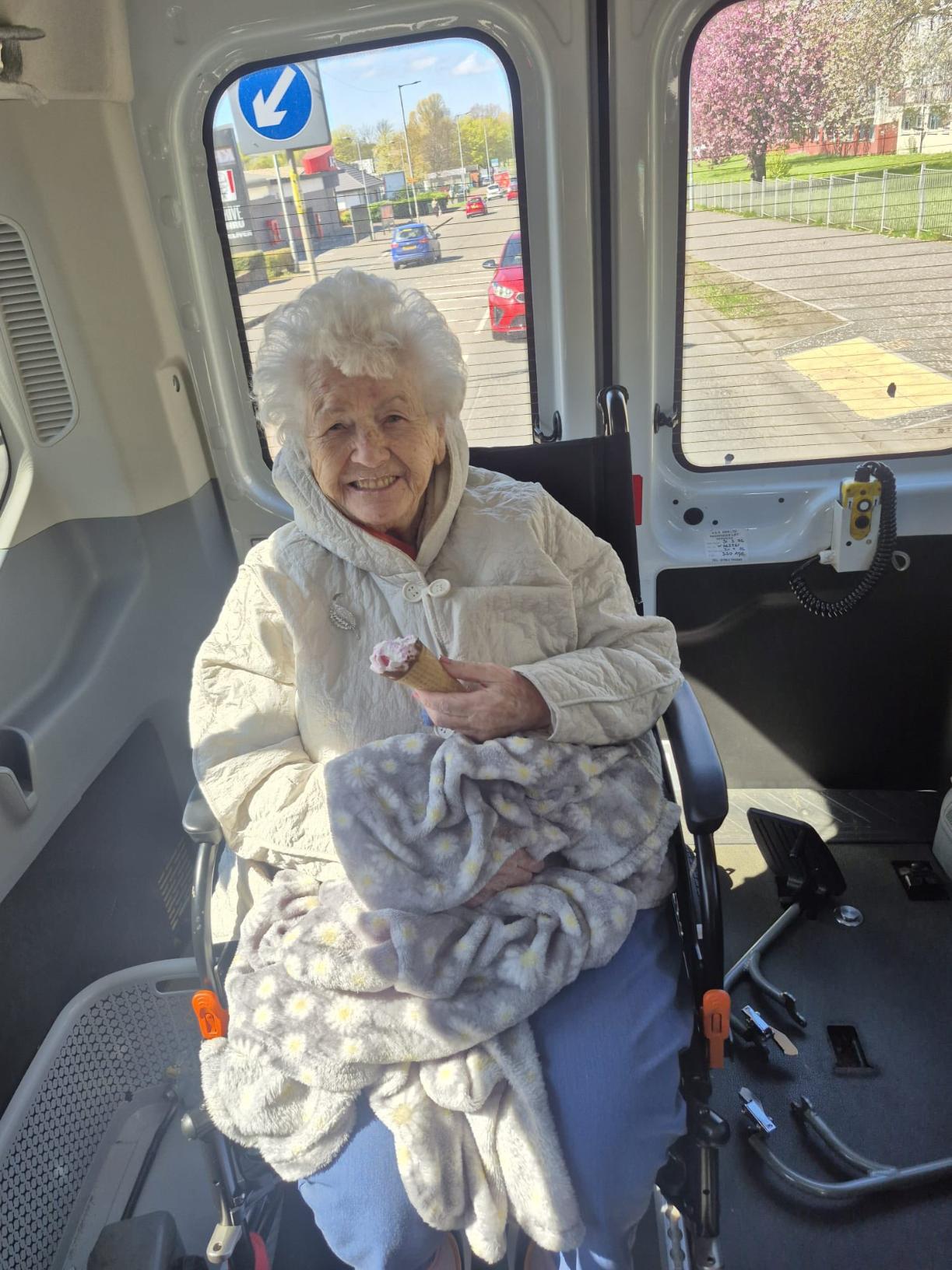 woman smiling on back of minibus
